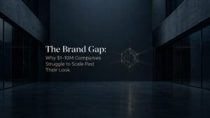 Dark architectural illustration of a gap between two structures, representing the brand gap that stops $1–10M companies from scaling